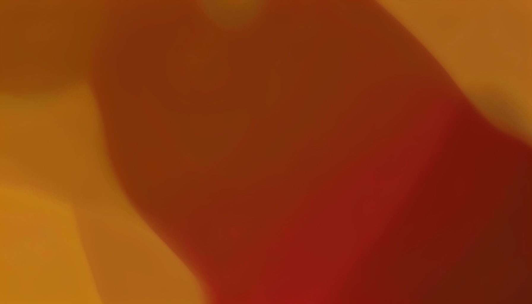 A warm abstract composition in amber and deep brown tones, with soft blurred contours and a subdued intimate ambiance